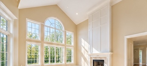 Open room with warm painted walls and white trim