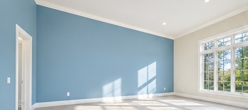 Empty room with blue walls and a white ceiling